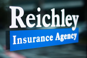 Reichley Insurance Agency logo on a glass door